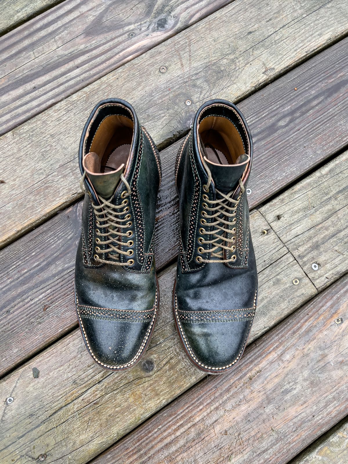 Photo by weathered.hide on January 6, 2023 of the Flame Panda Brogue Cap Toe Service Boot in Horween Marbled Black Shell Cordovan.