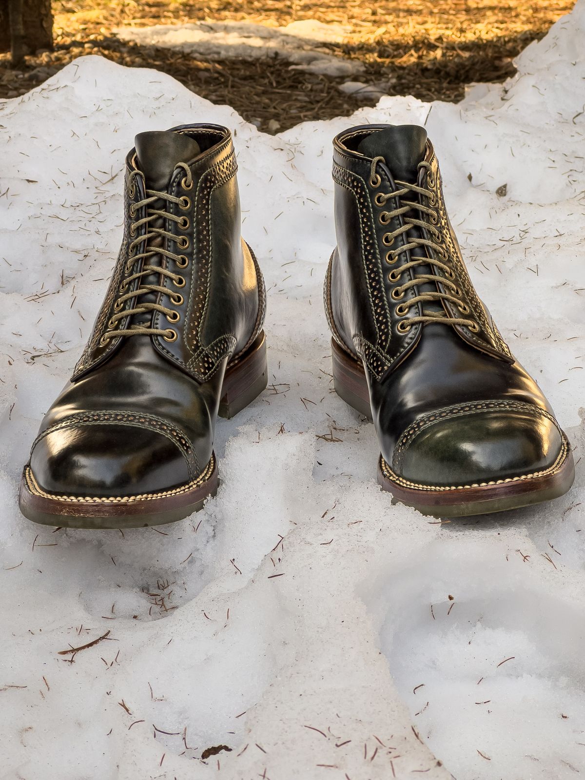 Photo by weathered.hide on February 6, 2023 of the Flame Panda Brogue Cap Toe Service Boot in Horween Marbled Black Shell Cordovan.