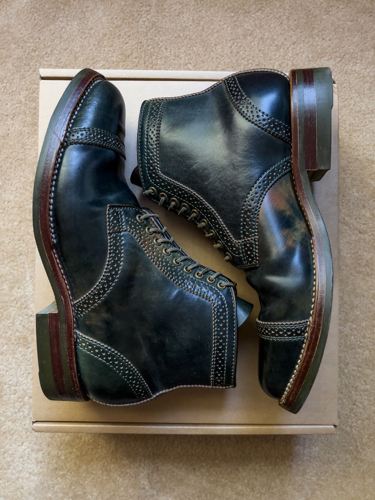 Photo by weathered.hide on February 6, 2023 of the Flame Panda Brogue Cap Toe Service Boot in Horween Marbled Black Shell Cordovan.