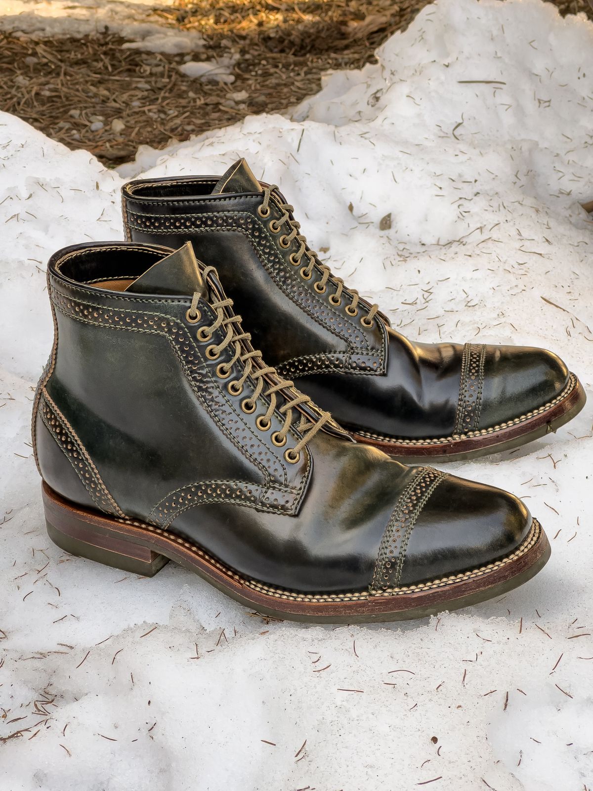 Photo by weathered.hide on February 6, 2023 of the Flame Panda Brogue Cap Toe Service Boot in Horween Marbled Black Shell Cordovan.