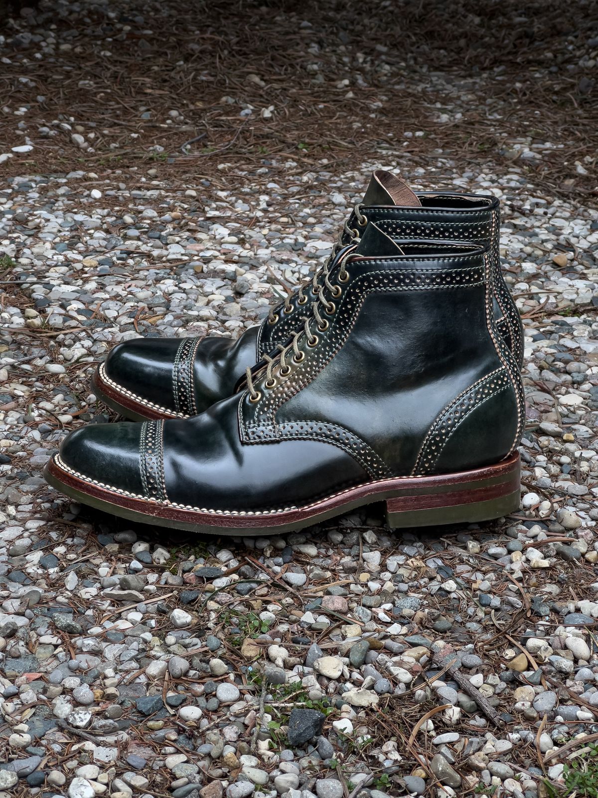 Photo by weathered.hide on March 5, 2023 of the Flame Panda Brogue Cap Toe Service Boot in Horween Marbled Black Shell Cordovan.