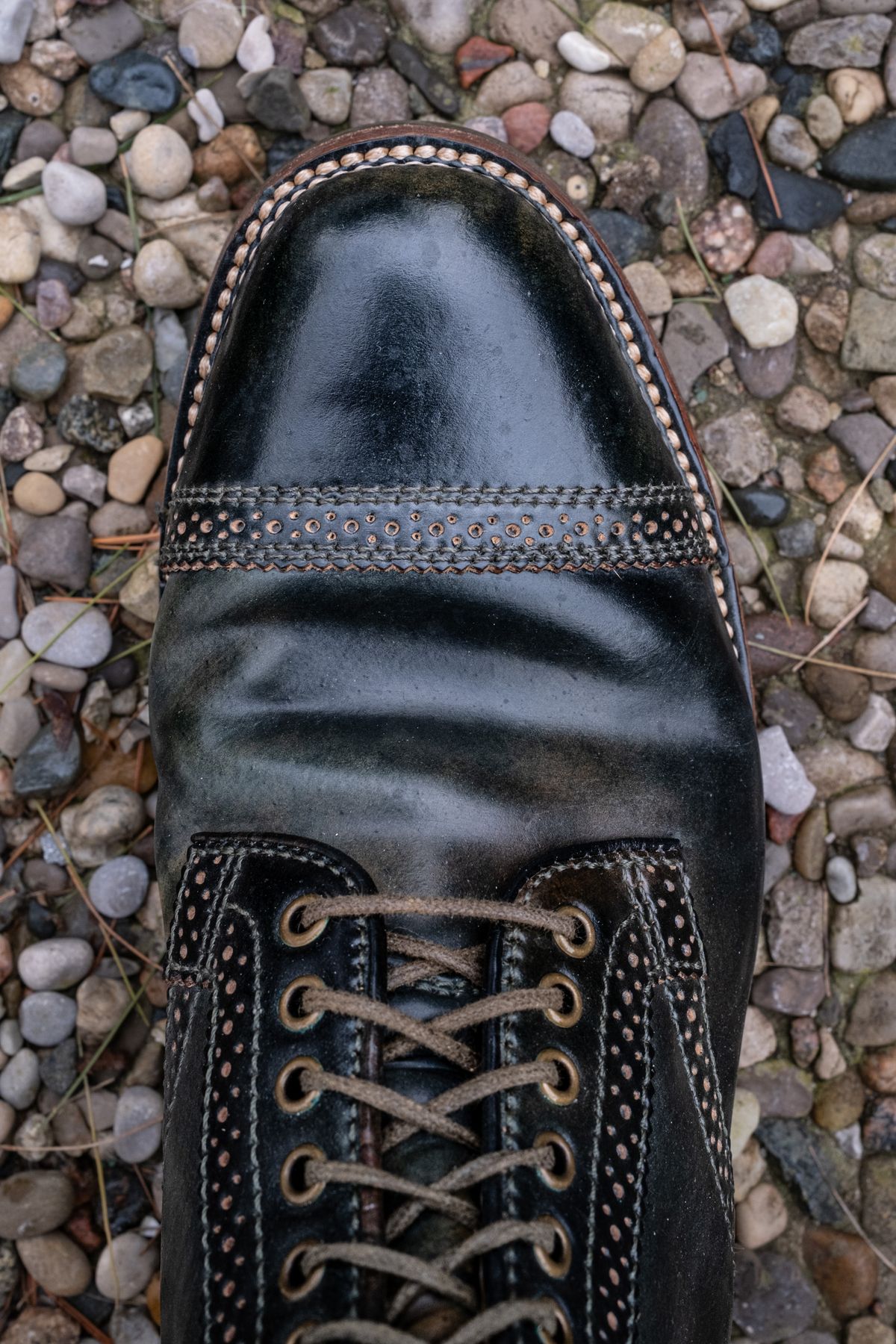 Photo by weathered.hide on April 5, 2023 of the Flame Panda Brogue Cap Toe Service Boot in Horween Marbled Black Shell Cordovan.