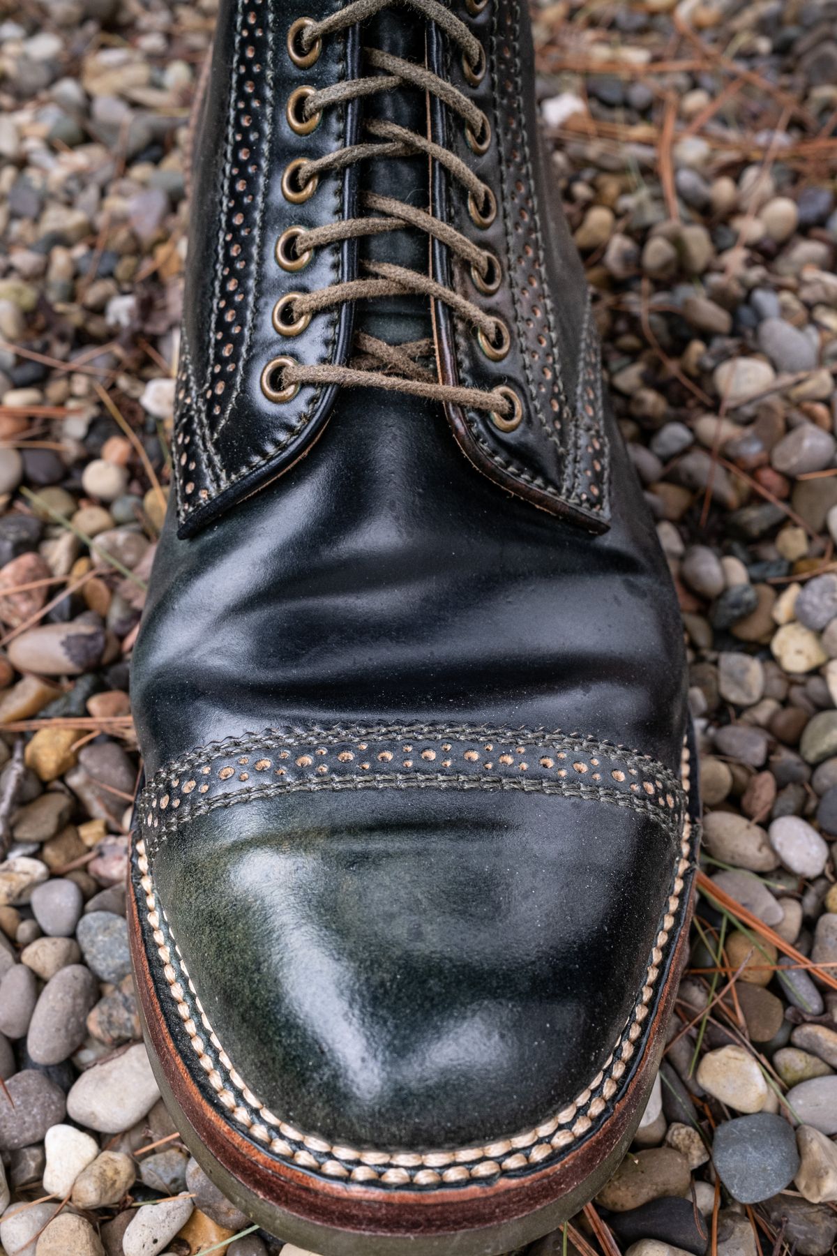 Photo by weathered.hide on April 5, 2023 of the Flame Panda Brogue Cap Toe Service Boot in Horween Marbled Black Shell Cordovan.