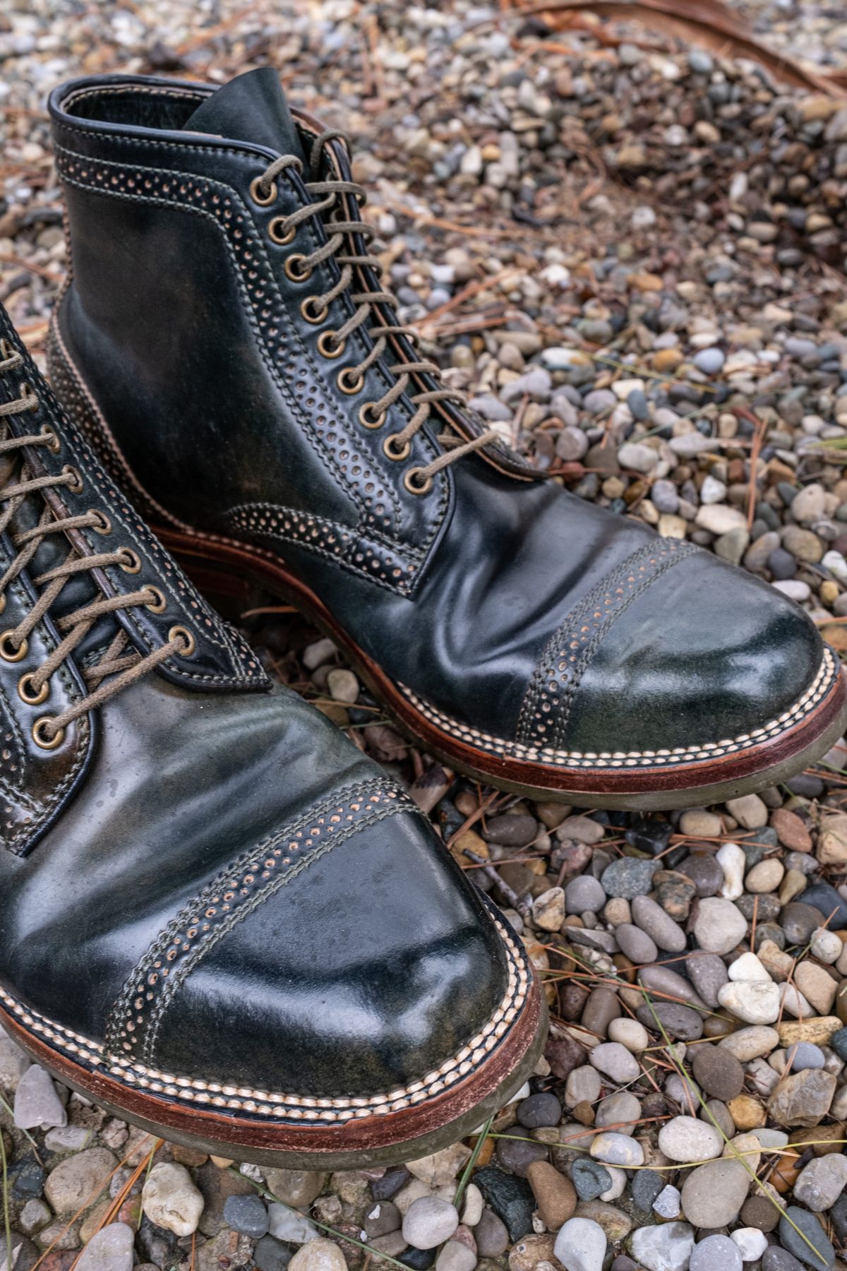 Photo by weathered.hide on April 6, 2023 of the Flame Panda Brogue Cap Toe Service Boot in Horween Marbled Black Shell Cordovan.