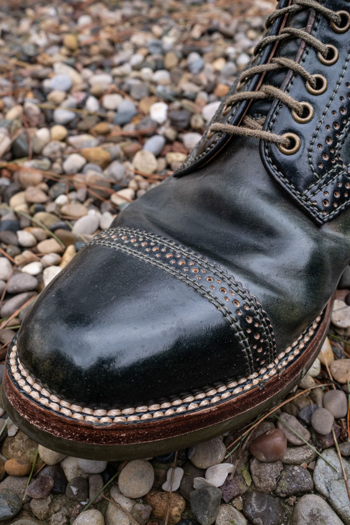 Photo by weathered.hide on April 6, 2023 of the Flame Panda Brogue Cap Toe Service Boot in Horween Marbled Black Shell Cordovan.