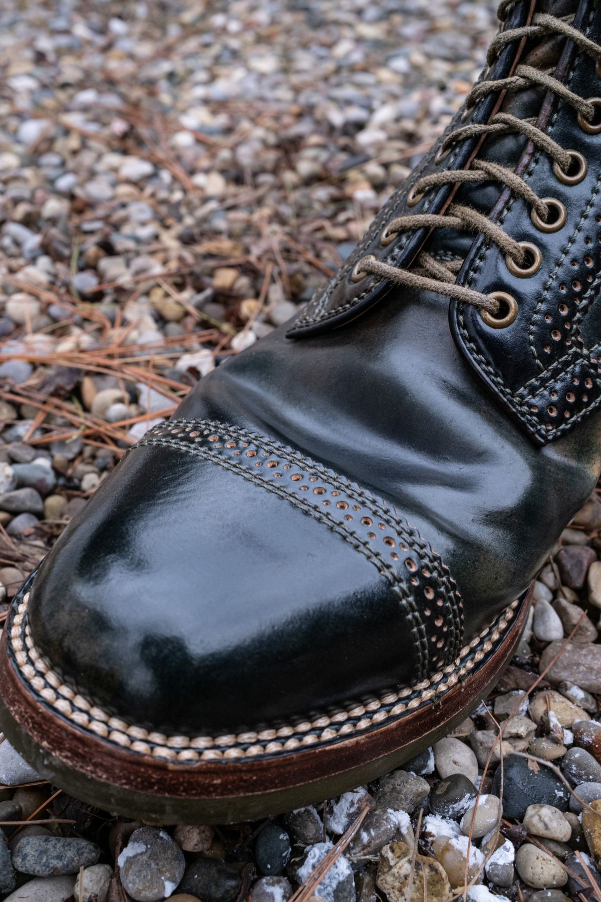 Photo by weathered.hide on April 6, 2023 of the Flame Panda Brogue Cap Toe Service Boot in Horween Marbled Black Shell Cordovan.