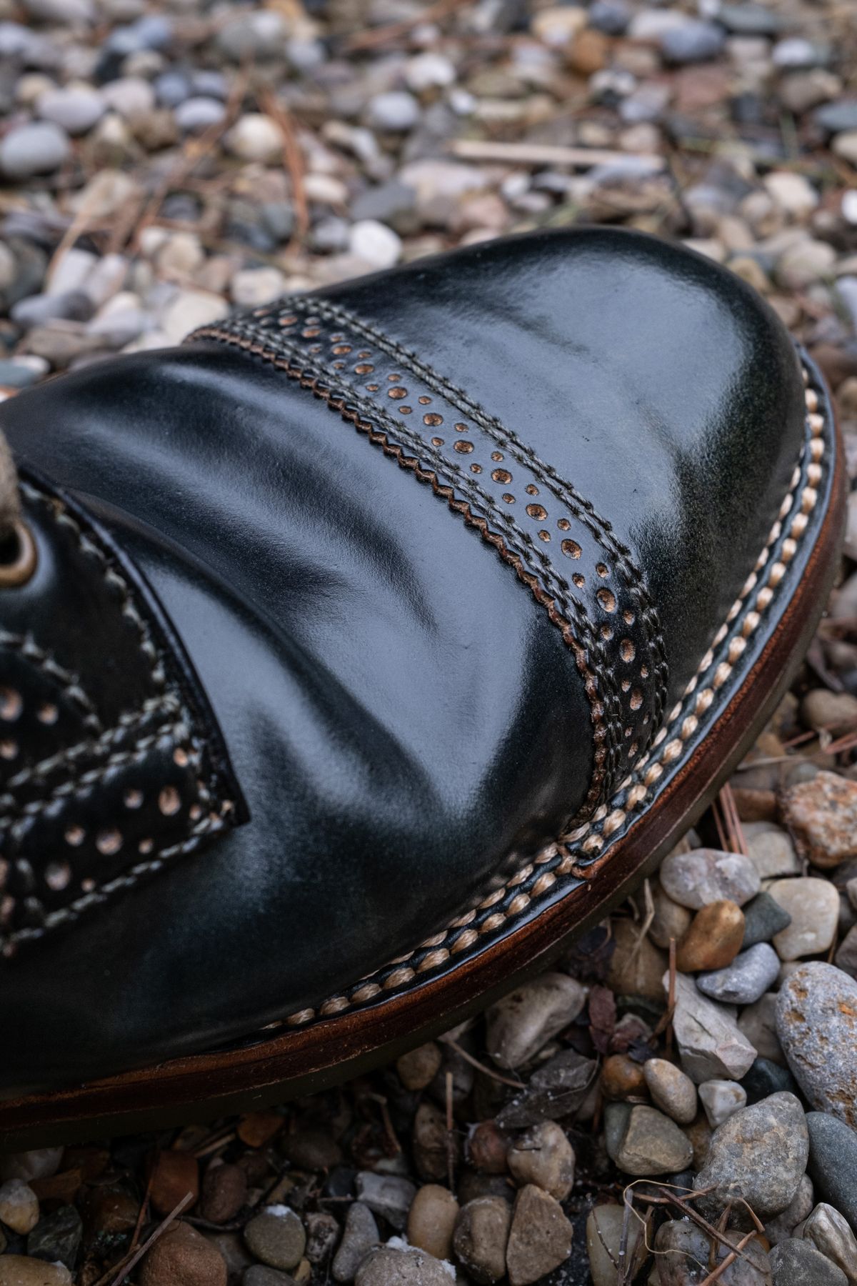 Photo by weathered.hide on April 6, 2023 of the Flame Panda Brogue Cap Toe Service Boot in Horween Marbled Black Shell Cordovan.