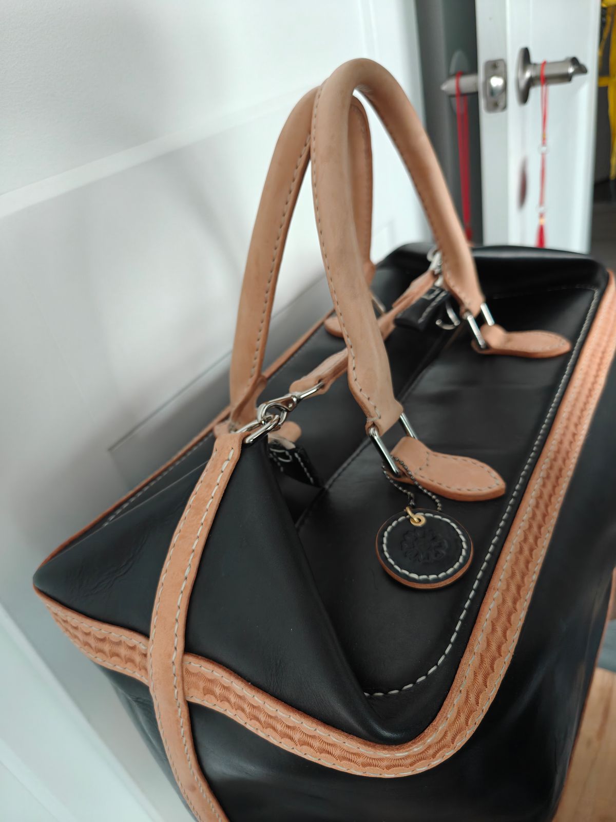 Photo by litespeedd on August 13, 2025 of the Black Lotus Leather Travel Bag in Weaver Natural Vegetable Tan Shoulder & La Bretagna Cowboy Black.
