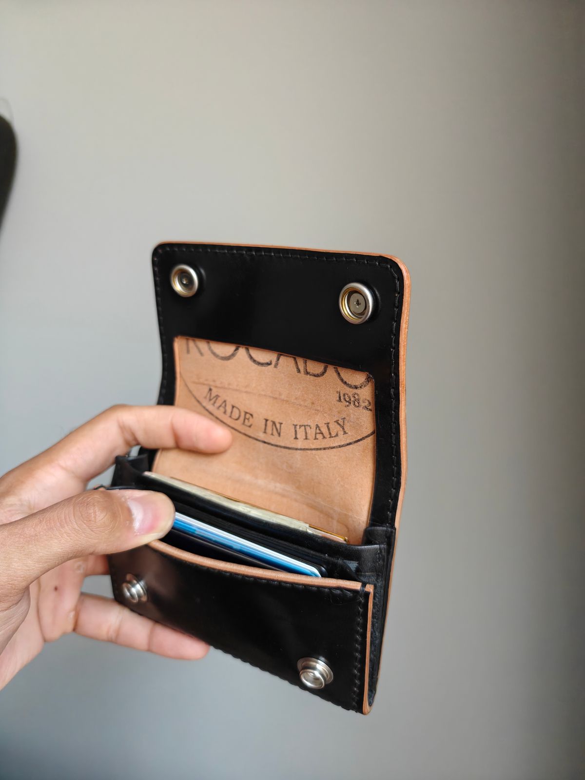 Photo by litespeedd on August 11, 2025 of the Black Lotus Leather Custom Tracker Wallet in Rocado Black Shell Cordovan.