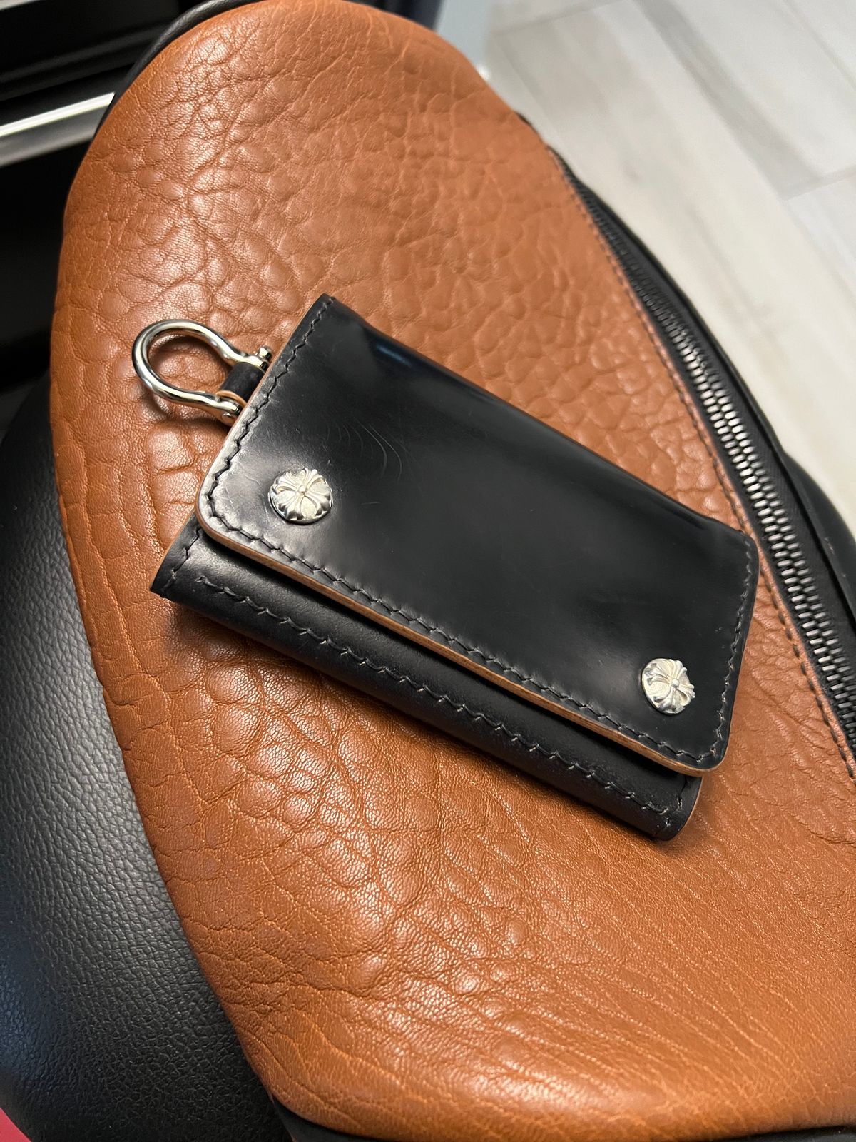 Photo by litespeedd on June 16, 2025 of the Black Lotus Leather Custom Tracker Wallet in Rocado Black Shell Cordovan.