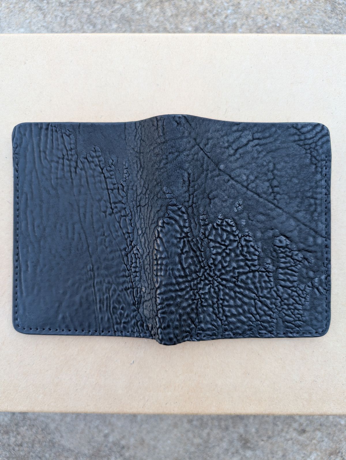 Photo by HealthyPatina on October 5, 2025 of the Ashland Leather Tall Fat Herbie in One-Off Horween Aspen Horsebutt (with shell intact) in Black.