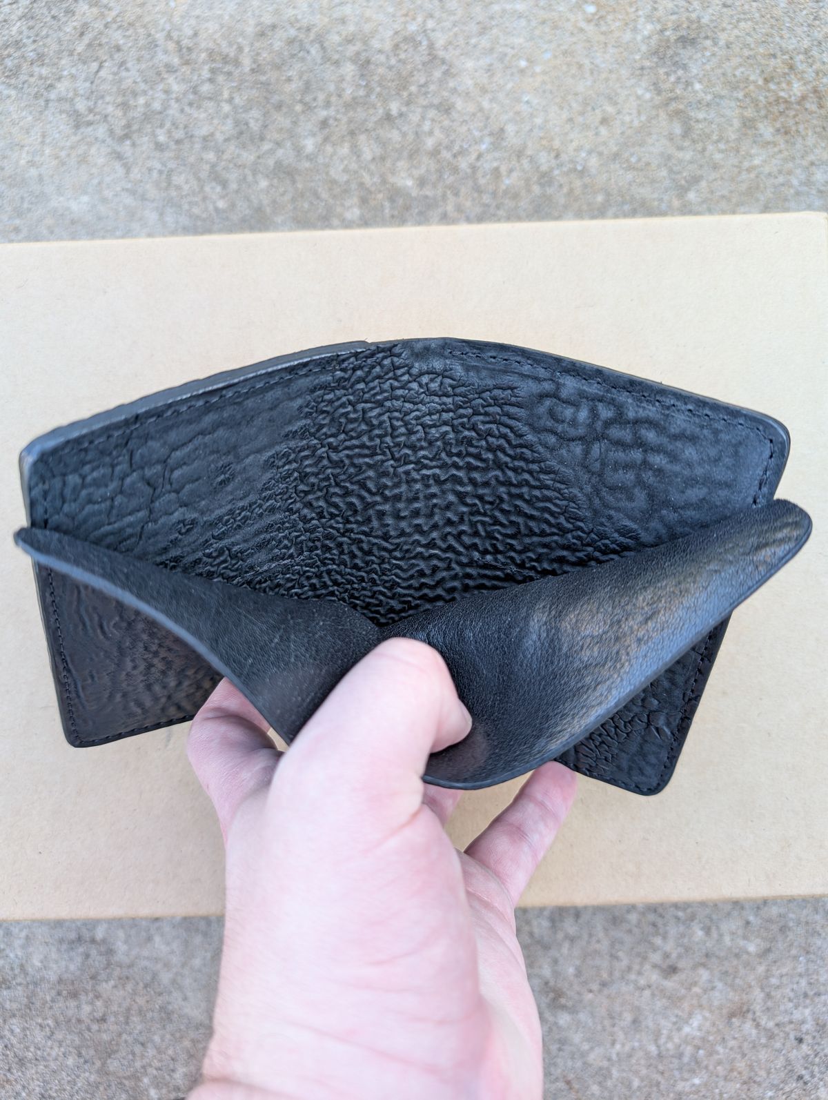 Photo by HealthyPatina on October 5, 2025 of the Ashland Leather Tall Fat Herbie in One-Off Horween Aspen Horsebutt (with shell intact) in Black.