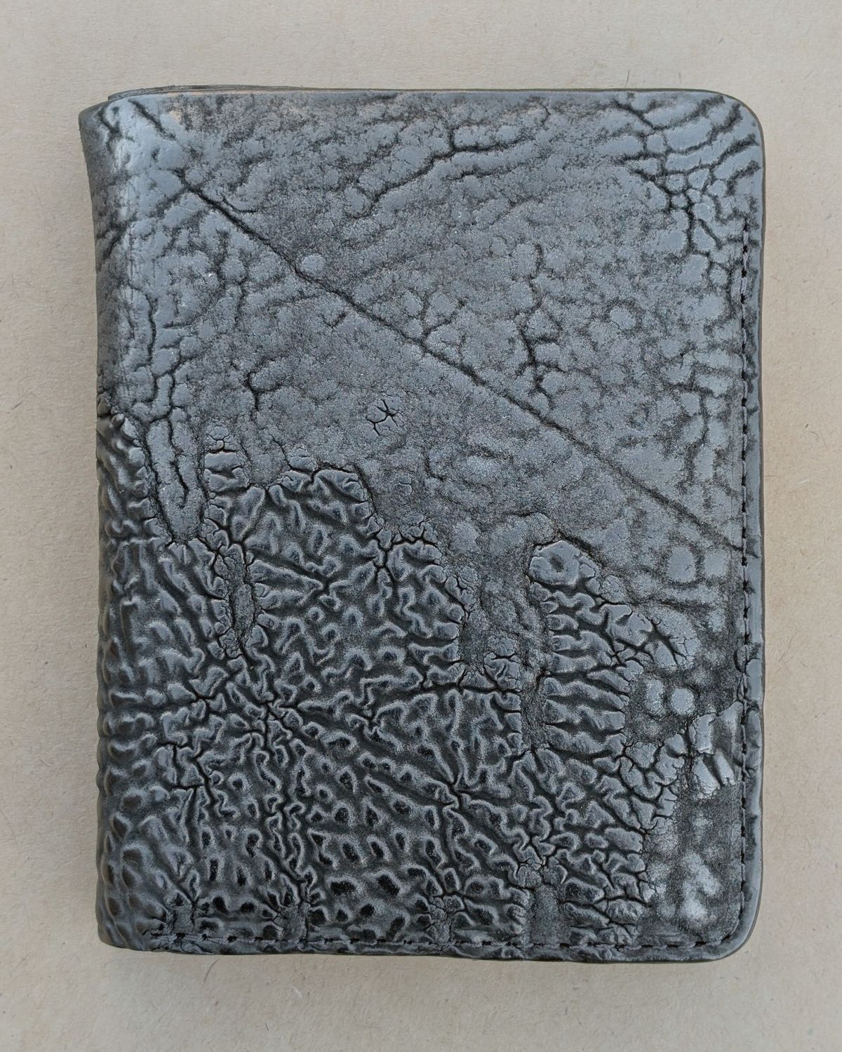 Photo by HealthyPatina on November 3, 2025 of the Ashland Leather Tall Fat Herbie in One-Off Horween Aspen Horsebutt (with shell intact) in Black.