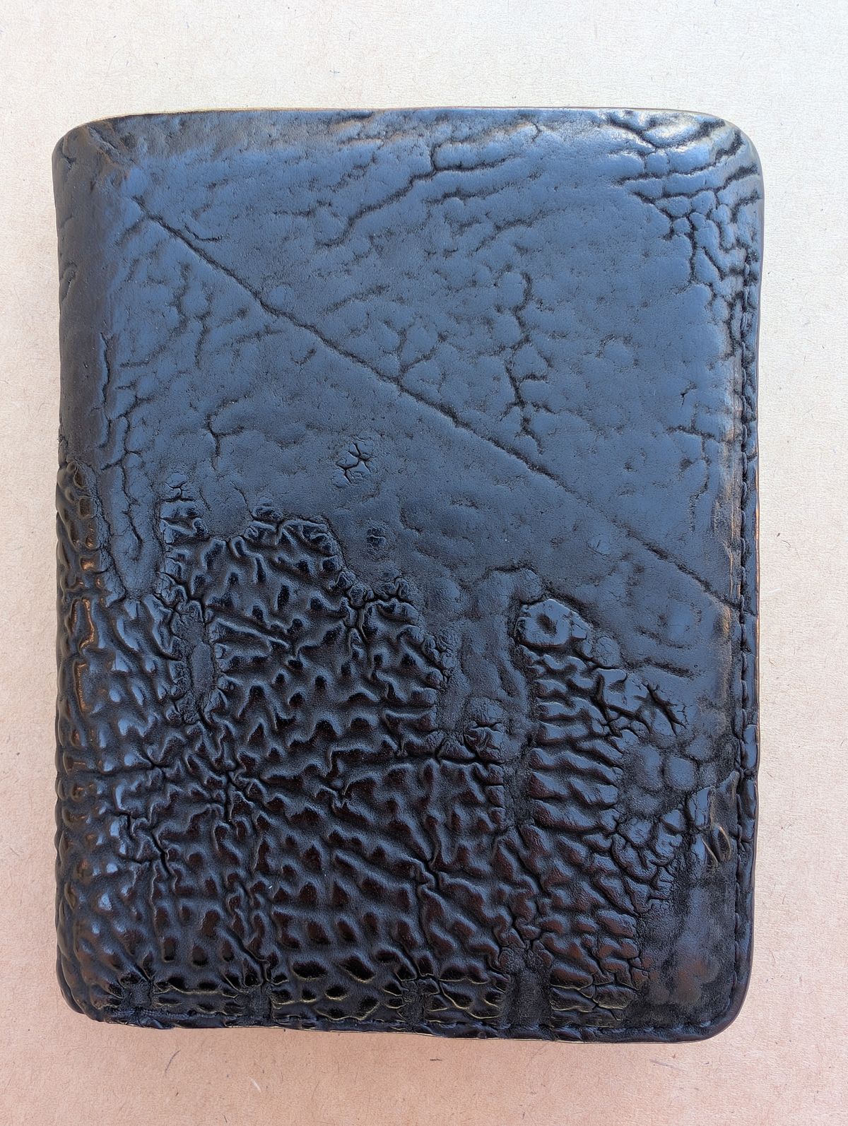 Photo by HealthyPatina on April 5, 2026 of the Ashland Leather Tall Fat Herbie in One-Off Horween Aspen Horsebutt (with shell intact) in Black.