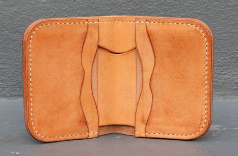 Photo by JewishJesus on November 2, 2025 of the Wild Frontier Goods Frontier Bifold Wallet in Kakishibu Hand Painted Shell Cordovan & Natural Buffed Cowhide.