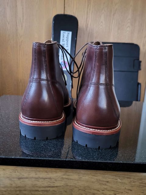 Photo by Mysterium on November 5, 2023 of the Grant Stone Brass Boot in Horween Crimson Chromexcel.