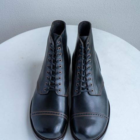 View photo of Nova Boots 40s Munson Combat Boots in Maryam Black Waxed Horsebutt