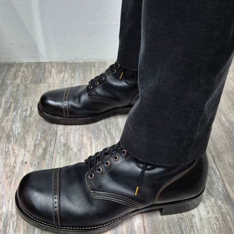 View photo of Nova Boots 40s Munson Combat Boots in Maryam Black Waxed Horsebutt