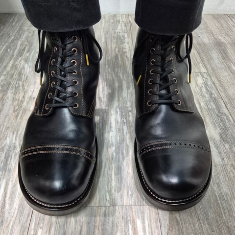 View photo of Nova Boots 40s Munson Combat Boots in Maryam Black Waxed Horsebutt