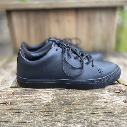 View photo of Thursday Premier Low Top in Black Vachetta