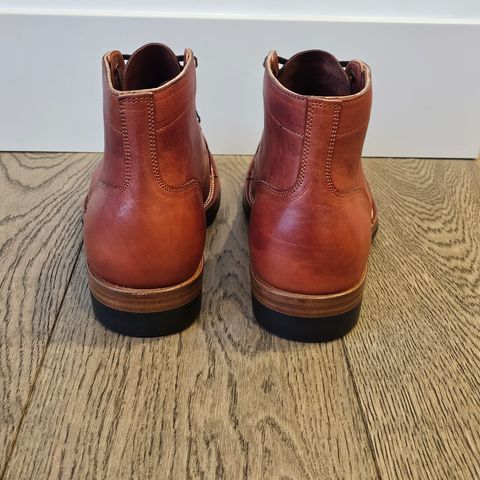 View photo of Iron Boots Pitman in Maryam Brick Red Hand-Dyed Horsehide