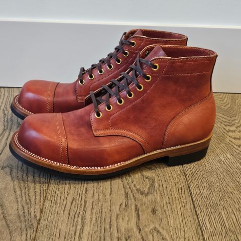 View photo of Iron Boots Pitman in Maryam Brick Red Hand-Dyed Horsehide