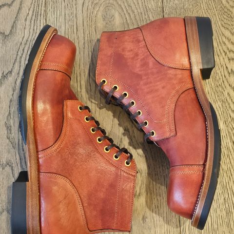 View photo of Iron Boots Pitman in Maryam Brick Red Hand-Dyed Horsehide