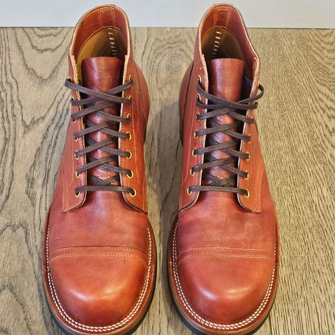 View photo of Iron Boots Pitman in Maryam Brick Red Hand-Dyed Horsehide