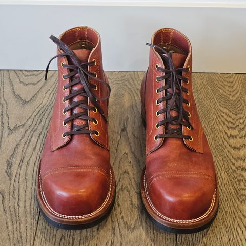 View photo of Iron Boots Pitman in Maryam Brick Red Hand-Dyed Horsehide