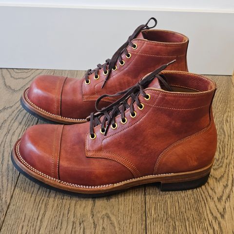 View photo of Iron Boots Pitman in Maryam Brick Red Hand-Dyed Horsehide