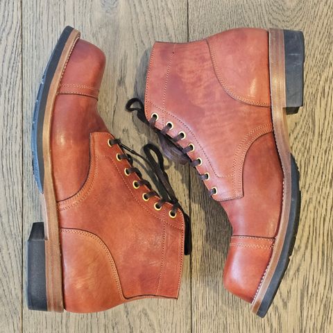 View photo of Iron Boots Pitman in Maryam Brick Red Hand-Dyed Horsehide