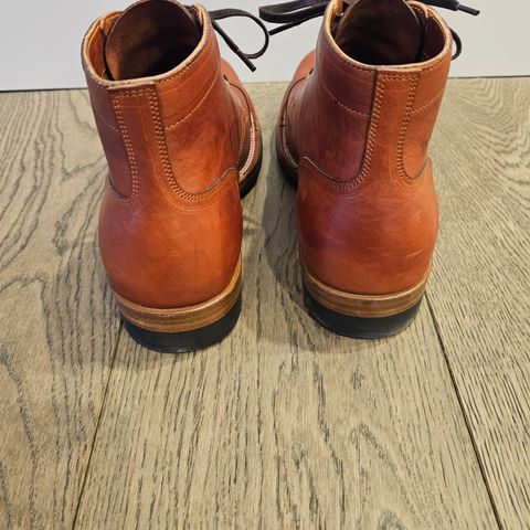 View photo of Iron Boots Pitman in Maryam Brick Red Hand-Dyed Horsehide