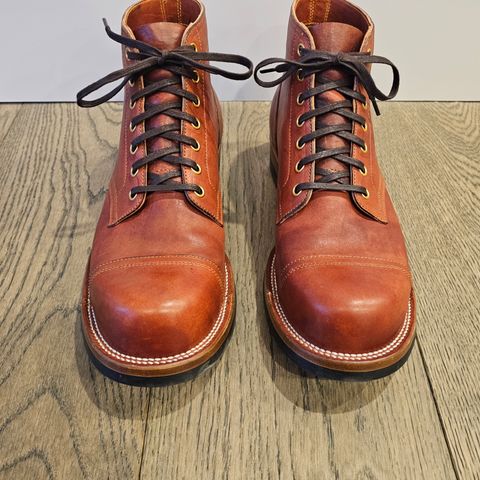 View photo of Iron Boots Pitman in Maryam Brick Red Hand-Dyed Horsehide