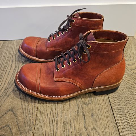 View photo of Iron Boots Pitman in Maryam Brick Red Hand-Dyed Horsehide