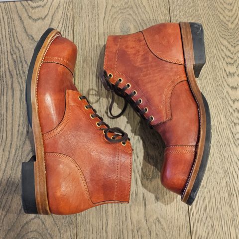 View photo of Iron Boots Pitman in Maryam Brick Red Hand-Dyed Horsehide