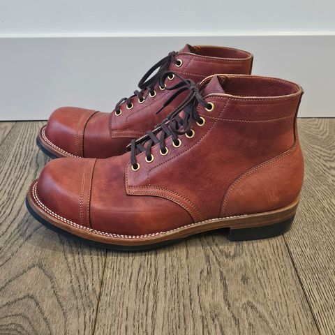 View photo of Iron Boots Pitman in Maryam Brick Red Hand-Dyed Horsehide