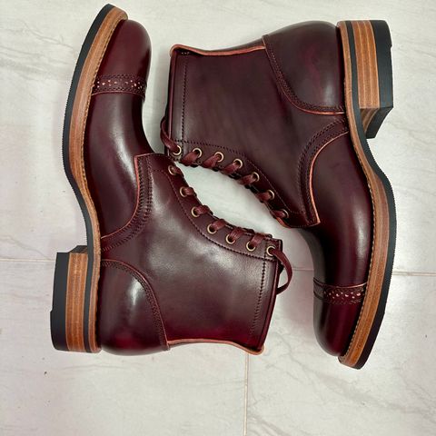 View photo of Flame Panda Brogue Cap Toe Service Boot in Maryam Burgundy-Overdyed Horsebutt