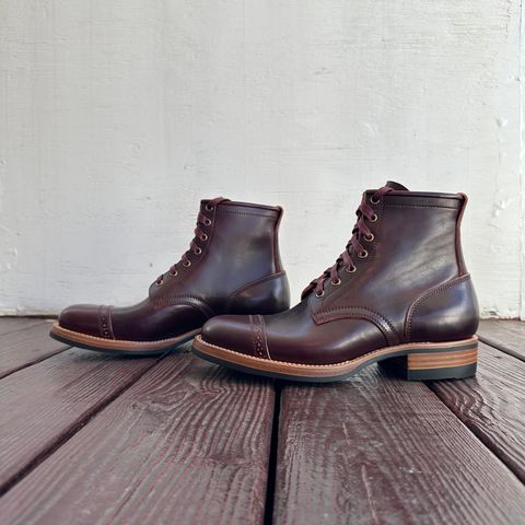 View photo of Flame Panda Brogue Cap Toe Service Boot in Maryam Burgundy-Overdyed Horsebutt