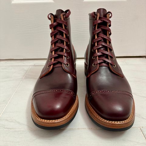 View photo of Flame Panda Brogue Cap Toe Service Boot in Maryam Burgundy-Overdyed Horsebutt