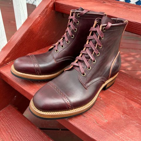 View photo of Flame Panda Brogue Cap Toe Service Boot in Maryam Burgundy-Overdyed Horsebutt